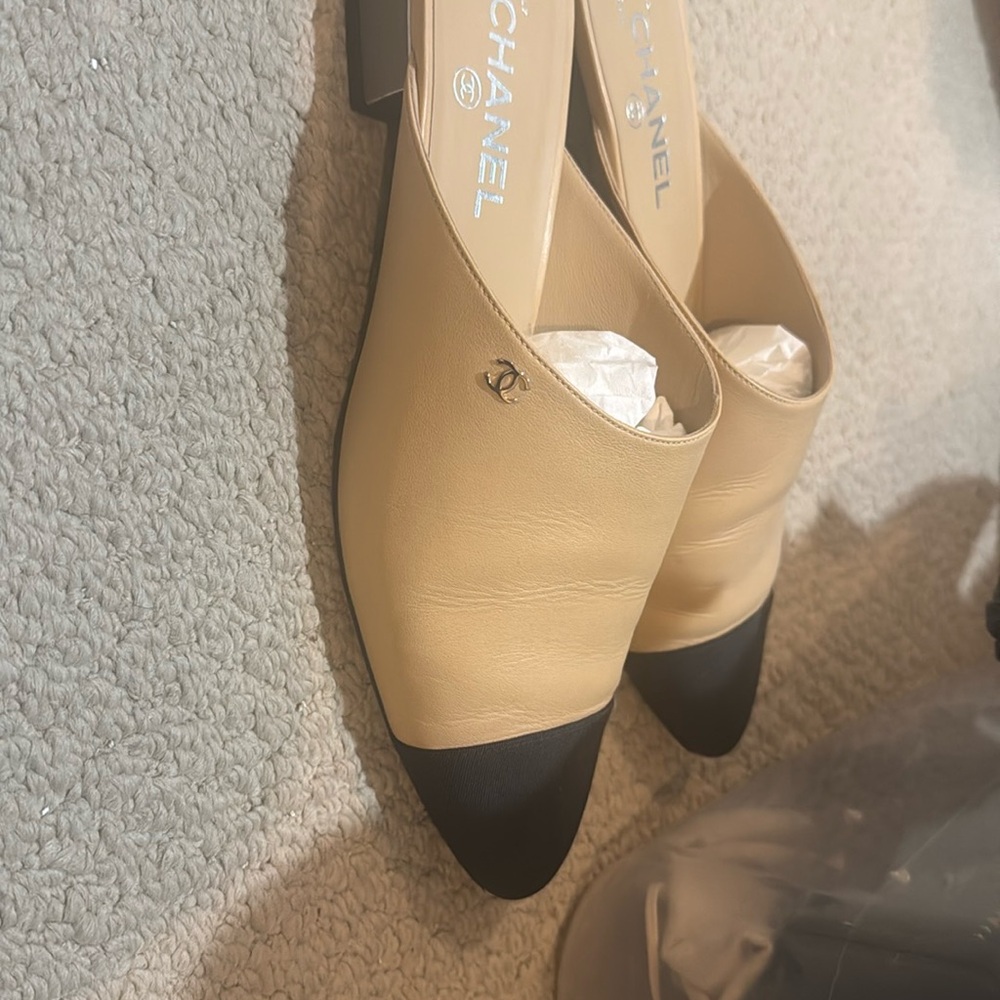 CHANEL Cream and Black Mules with Classic Cap-Toe Design